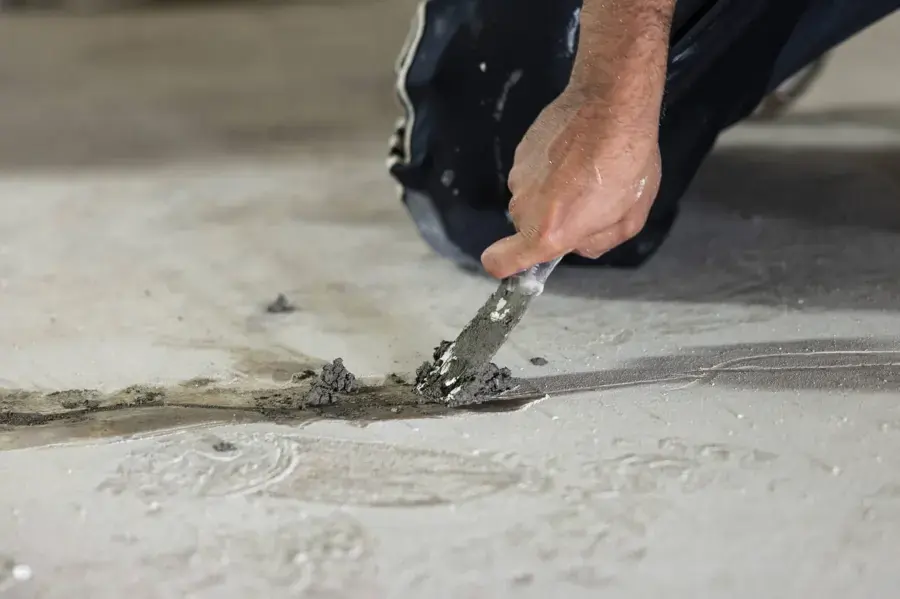 Concrete slab opened along a wet crack to reach a leaking line under a Weatherford home